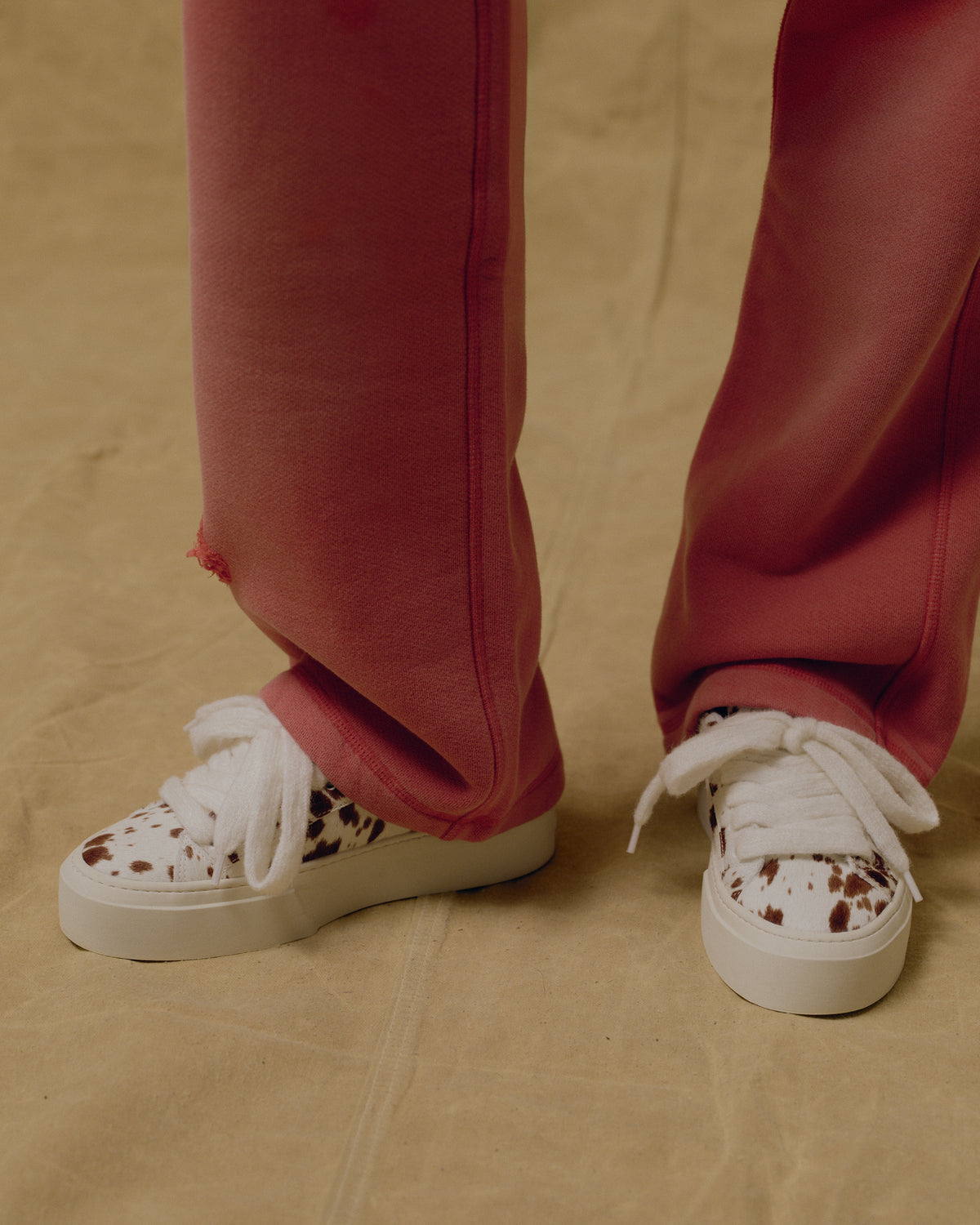 The Bambi OG sneakers worn with red trousers